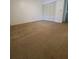 Cozy bedroom offers neutral walls, soft carpeting, and a spacious closet at 3124 S Semoran Blvd # 206, Orlando, FL 32822
