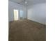 Bright bedroom featuring soft carpet, a ceiling fan and adjacent bathroom and closet at 3124 S Semoran Blvd # 206, Orlando, FL 32822