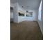 Open dining area featuring carpet flooring, neutral walls, and natural light from window at 3124 S Semoran Blvd # 206, Orlando, FL 32822
