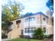 Inviting exterior of the home, surrounded by mature trees and well-maintained landscaping at 3124 S Semoran Blvd # 206, Orlando, FL 32822