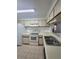 Functional kitchen features ample counter space and well-maintained white appliances at 3124 S Semoran Blvd # 206, Orlando, FL 32822