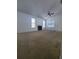 Spacious living room with fireplace, neutral walls, carpet, and ample natural light at 3124 S Semoran Blvd # 206, Orlando, FL 32822