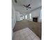 Inviting living room featuring a fireplace, neutral carpet, and ample natural lighting at 3124 S Semoran Blvd # 206, Orlando, FL 32822