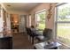 Bright dining area with large windows, stylish seating, and views of the landscaped yard at 314 Windmeadows St # 314, Altamonte Springs, FL 32701