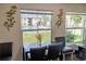 Well-lit dining area offering a view of the sparkling community pool, with comfortable seating and stylish decor at 314 Windmeadows St # 314, Altamonte Springs, FL 32701