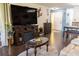 Spacious living room with dark wood floors, fireplace, and ample seating at 314 Windmeadows St # 314, Altamonte Springs, FL 32701