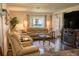 Comfortable living room with plush seating, fireplace, and a view to the outside at 314 Windmeadows St # 314, Altamonte Springs, FL 32701