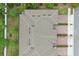 Aerial view of townhome community showcasing rooflines, landscaping, and parking at 328 Cedar Bark Ln, Sanford, FL 32771
