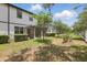 Spacious backyard featuring a lawn and patio area with privacy hedges at 328 Cedar Bark Ln, Sanford, FL 32771