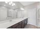 Bright bathroom with double vanity, large mirror, and a separate shower and tub at 328 Cedar Bark Ln, Sanford, FL 32771