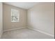 Neutral bedroom with large window offering natural light and plush carpeting at 328 Cedar Bark Ln, Sanford, FL 32771