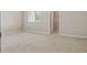 Cozy bedroom features a window with blinds and an attached walk-in closet at 328 Cedar Bark Ln, Sanford, FL 32771