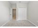 Carpeted bedroom with neutral walls and a closet for storage at 328 Cedar Bark Ln, Sanford, FL 32771