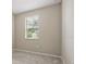 Bedroom features a carpeted floor, one window and grey walls at 328 Cedar Bark Ln, Sanford, FL 32771