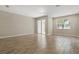 Bright and spacious bedroom with a window, tile floors, and sliding glass door access to closet at 328 Cedar Bark Ln, Sanford, FL 32771