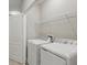 Functional laundry area with modern washer and dryer units and shelving at 328 Cedar Bark Ln, Sanford, FL 32771