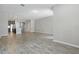 Open living room showcasing tile floors and view to the kitchen with stainless steel appliances at 328 Cedar Bark Ln, Sanford, FL 32771