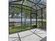 Enclosed patio featuring shade and views of the lush green backyard at 328 Cedar Bark Ln, Sanford, FL 32771