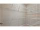 Spacious walk-in closet featuring white wire shelving for optimal storage at 328 Cedar Bark Ln, Sanford, FL 32771