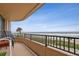 Balcony offering views of the ocean, tropical foliage, and seating area to enjoy the scene at 3360 Ocean Shore Blvd # 4050, Ormond Beach, FL 32176