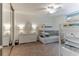 Bright bedroom featuring built-in bunk beds, dresser with mirror, and ample closet space at 3360 Ocean Shore Blvd # 4050, Ormond Beach, FL 32176