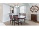 Charming dining area with a round table and seating for four near the kitchen at 3360 Ocean Shore Blvd # 4050, Ormond Beach, FL 32176