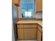 Kitchen featuring updated countertops and cabinetry with a view of the living area at 3360 Ocean Shore Blvd # 4050, Ormond Beach, FL 32176