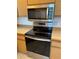 Updated kitchen features stainless steel appliances and light wood cabinetry at 3360 Ocean Shore Blvd # 4050, Ormond Beach, FL 32176