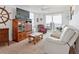 Comfortable living room with a large window and sliding glass door to balcony at 3360 Ocean Shore Blvd # 4050, Ormond Beach, FL 32176