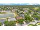 Aerial view showcasing the residential neighborhood, with lush greenery and a serene pond at 4047 Lillian Hall Ln, Orlando, FL 32812