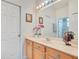 This bathroom offers neutral finishes, a large mirror, and a bright aesthetic at 4047 Lillian Hall Ln, Orlando, FL 32812