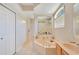 Bright bathroom boasts a garden tub and separate shower, perfect for a luxurious bathing experience at 4047 Lillian Hall Ln, Orlando, FL 32812