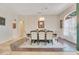 Elegant dining room featuring a large table with upholstered chairs and a stylish chandelier at 4047 Lillian Hall Ln, Orlando, FL 32812