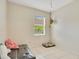 This room provides flexible space with a window and neutral finishes at 4047 Lillian Hall Ln, Orlando, FL 32812