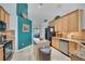 Kitchen features stainless appliances, granite countertops, and a center island for food preparation and casual dining at 4047 Lillian Hall Ln, Orlando, FL 32812
