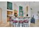 Kitchen with granite counters, stainless appliances, breakfast bar with seating and designer backsplash at 4047 Lillian Hall Ln, Orlando, FL 32812