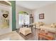 Light-filled living room with hardwood floors, cream walls, and comfortable seating at 4047 Lillian Hall Ln, Orlando, FL 32812