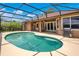 Beautiful in-ground screened pool with ample patio space, ideal for outdoor living and entertaining at 4047 Lillian Hall Ln, Orlando, FL 32812