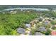 Aerial view of neighborhood featuring lake views and lush greenery at 4052 Gilder Rose Pl, Winter Park, FL 32792