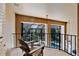 Relaxing balcony with comfortable seating overlooking a screened pool and lush greenery at 4052 Gilder Rose Pl, Winter Park, FL 32792