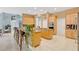 Expansive kitchen with a large island, bar seating, light wood cabinetry, and tile flooring at 4052 Gilder Rose Pl, Winter Park, FL 32792