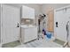 Well-organized laundry room with a sink, storage cabinets, and access to the outdoors at 4052 Gilder Rose Pl, Winter Park, FL 32792