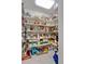 Spacious walk-in pantry with ample shelving for organized food and supply storage at 4052 Gilder Rose Pl, Winter Park, FL 32792