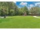 Community park featuring a playground, picnic tables, benches, and lush green lawn at 4052 Gilder Rose Pl, Winter Park, FL 32792