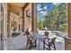 Spacious screened-in patio with a dining table and seating area near the pool and garden at 4052 Gilder Rose Pl, Winter Park, FL 32792