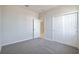 Cozy bedroom with plush carpeting, closet, and ample natural light at 4125 Lavender Ct, Lake Hamilton, FL 33851
