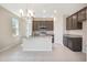 Bright, open kitchen with stainless-steel appliances, granite counters, seamlessly connects living space at 4125 Lavender Ct, Lake Hamilton, FL 33851