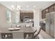 Well-lit kitchen boasting granite countertops, modern stainless-steel appliances, and ample cabinet space at 4125 Lavender Ct, Lake Hamilton, FL 33851