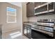 Well-equipped kitchen with stainless steel appliances, granite countertops, and ample cabinet space at 4125 Lavender Ct, Lake Hamilton, FL 33851