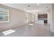 Spacious, sun-lit living area with tile floors, providing easy access to the kitchen and dining area at 4125 Lavender Ct, Lake Hamilton, FL 33851